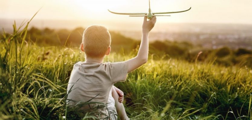 little-boy-sitting-on-the-meadow-with-toy-airplane-2022-06-10-06-47-39-utc (Medium)